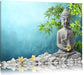Buddha auf Steinen mit Monoi Blüte Leinwandbild