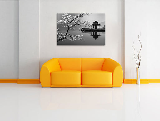 Kirschbaum an See B&W Leinwandbild über Sofa