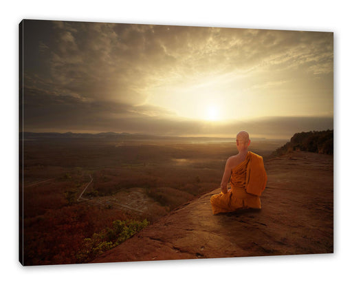 Mönch meditiert auf Felsvorsprung Leinwanbild Rechteckig