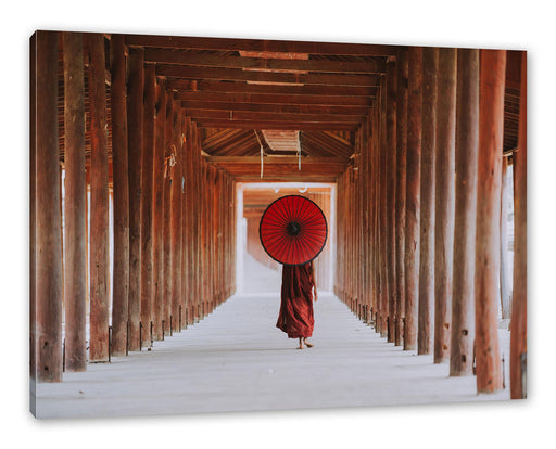 Mönch mit rotem Schirm im Tempelgang Leinwanbild Rechteckig