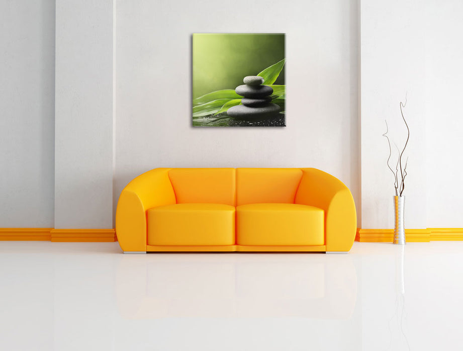 Zen Steine mit Blättern Leinwandbild Quadratisch über Sofa