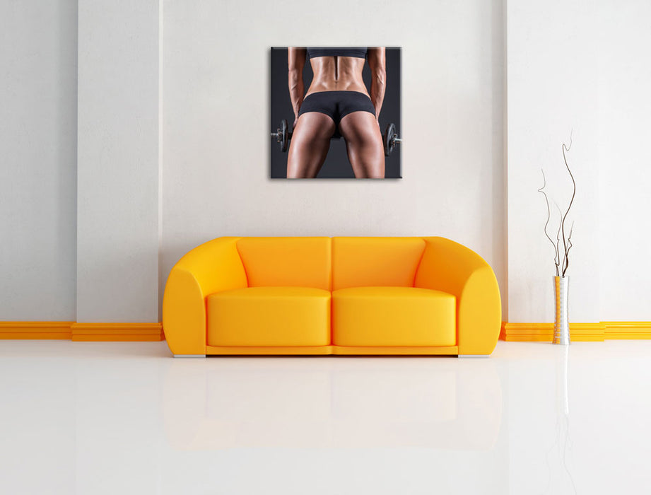 Sexy Frau mit Hanteln Leinwandbild Quadratisch über Sofa