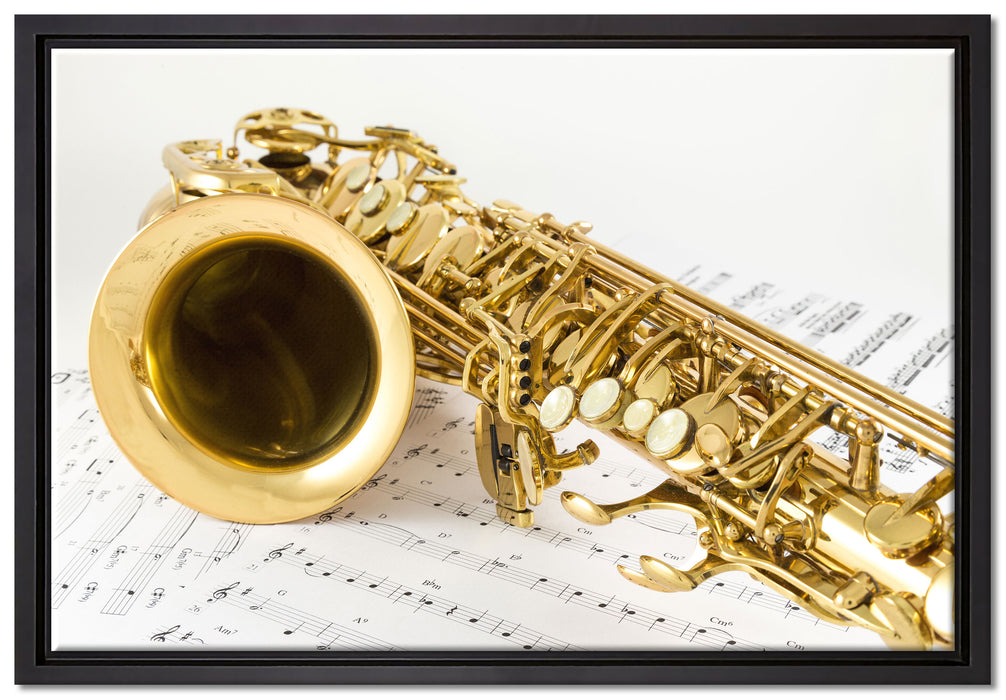Saxophon auf Notenpapier auf Leinwandbild gerahmt Größe 60x40