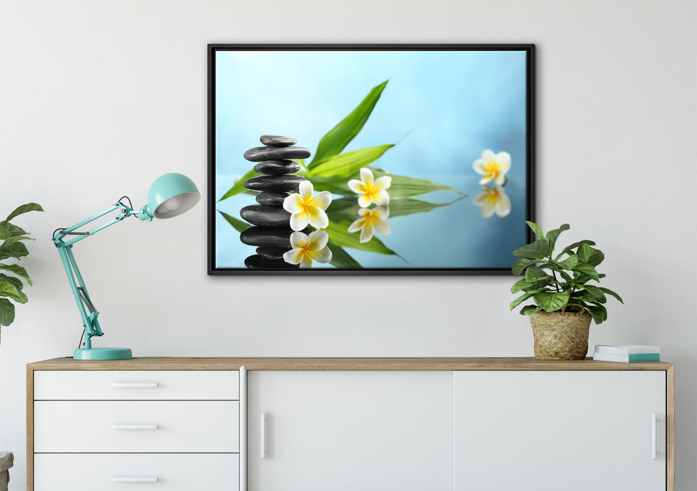 Zen Steinturm Monoi Blüten auf Leinwandbild gerahmt verschiedene Größen im Wohnzimmer