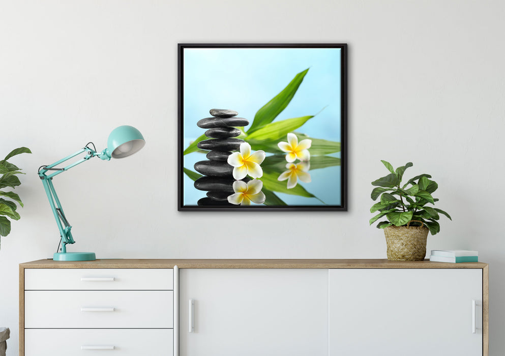 Zen Steinturm Monoi Blüten auf Leinwandbild gerahmt Quadratisch verschiedene Größen im Wohnzimmer