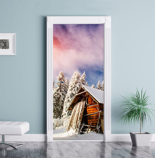 Holzhütte im Schnee Türaufkleber im Wohnzimmer