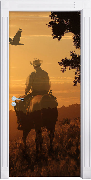 Ein Cowboy im Sonnenuntergang Türaufkleber