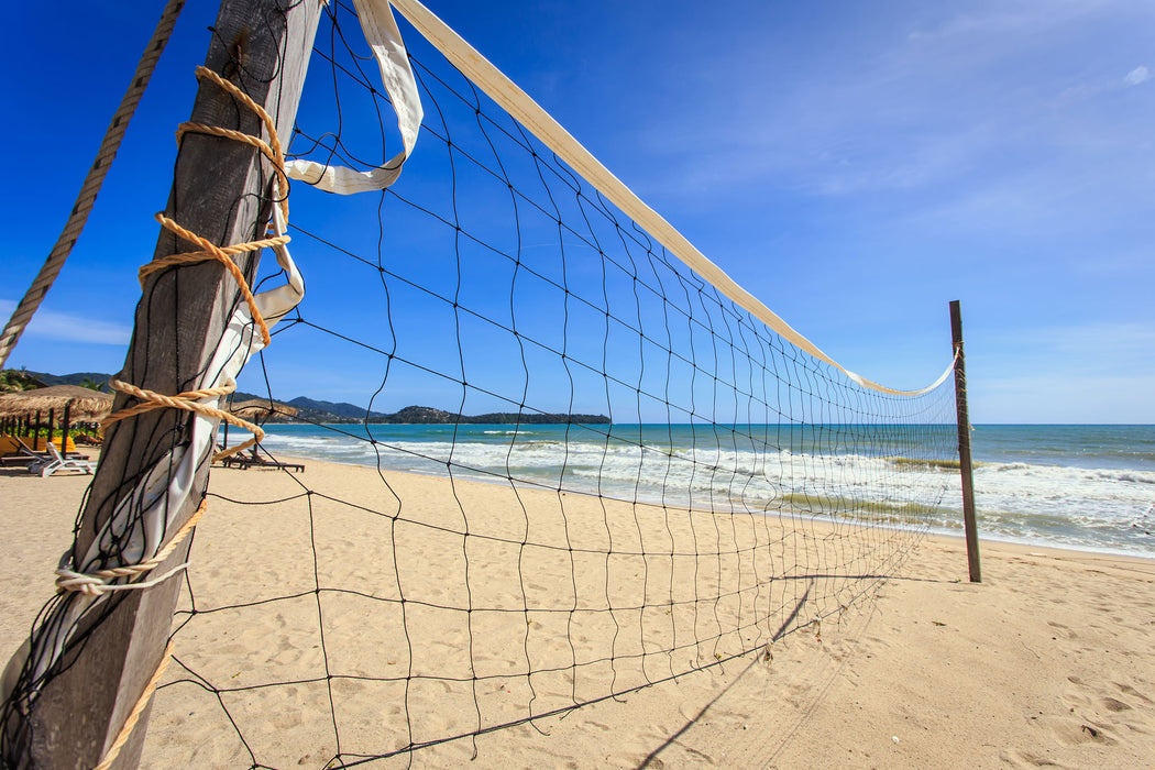 Volleyballnetz am Strand, Glasbild