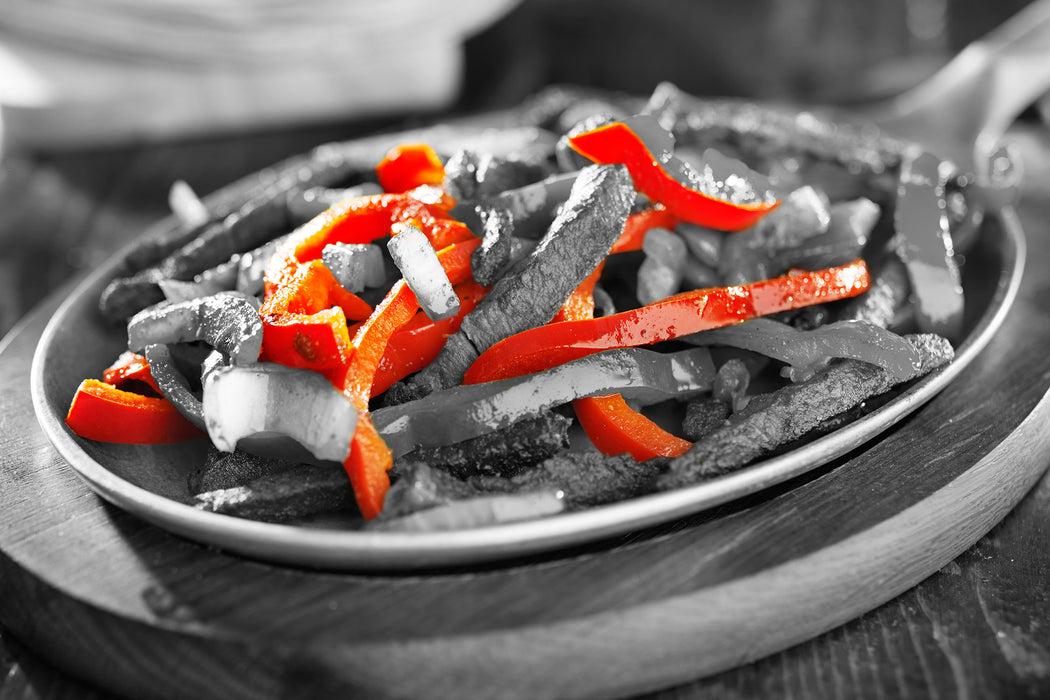 Gegarte Fleischpfanne mit Paprika, Glasbild