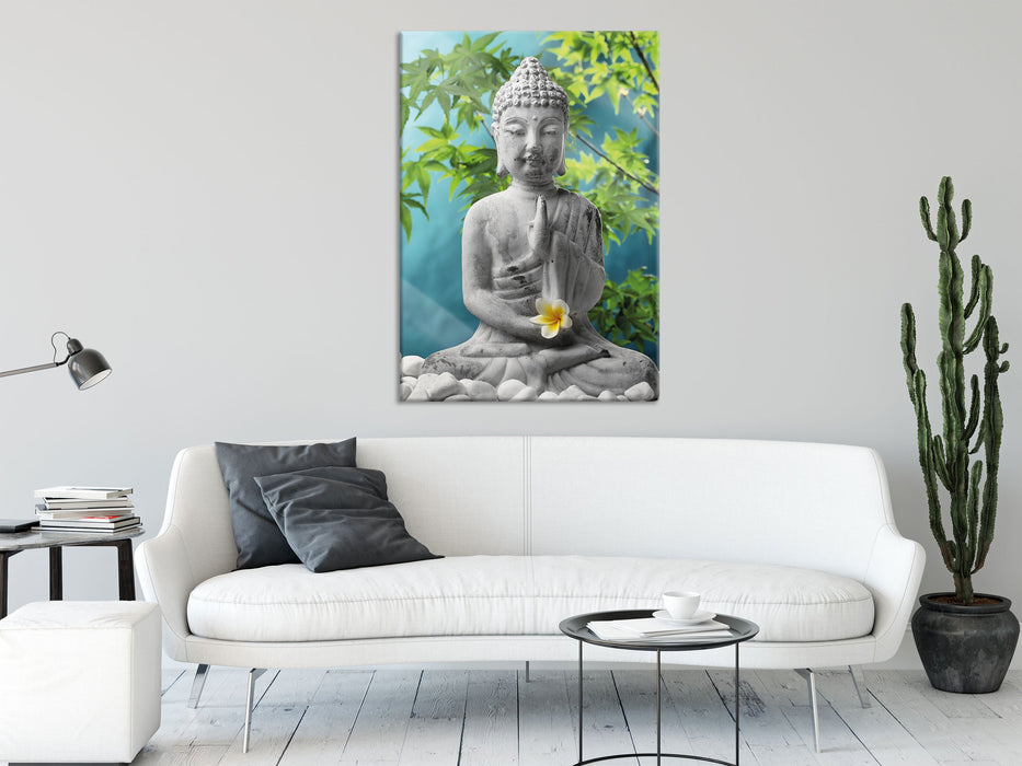 Buddha auf Steinen mit Monoi Blüte, Glasbild