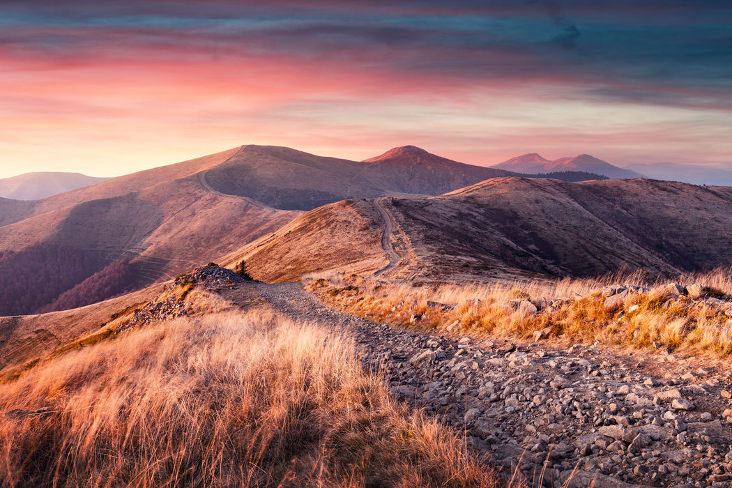 Steinlandschaft bei Sonnenuntergang, Glasbild