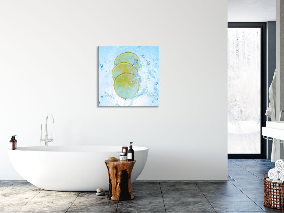 Zitrone fällt ins Wasser, Glasbild Quadratisch