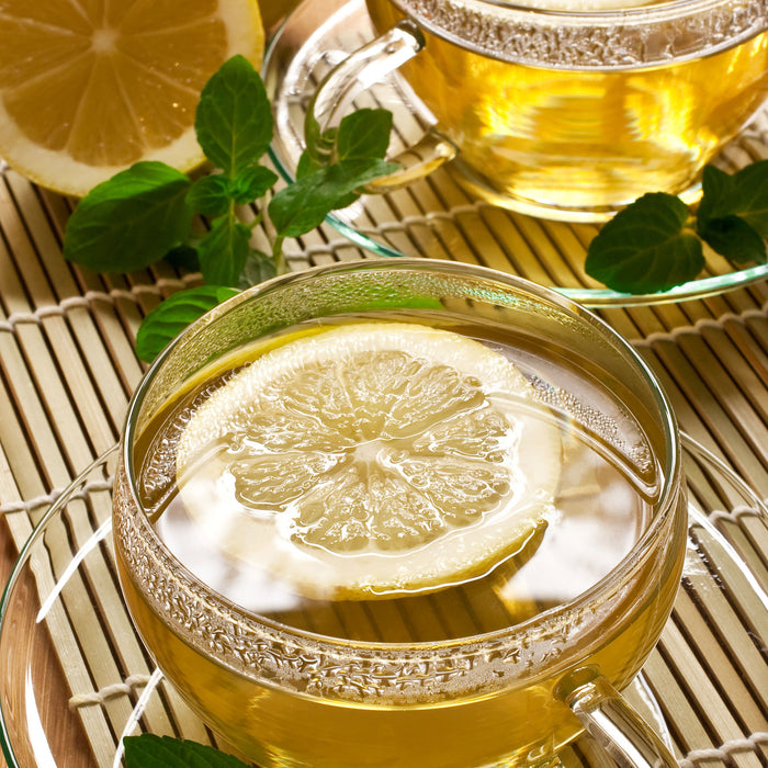 GrünerTee mit Zitrone, Glasbild Quadratisch