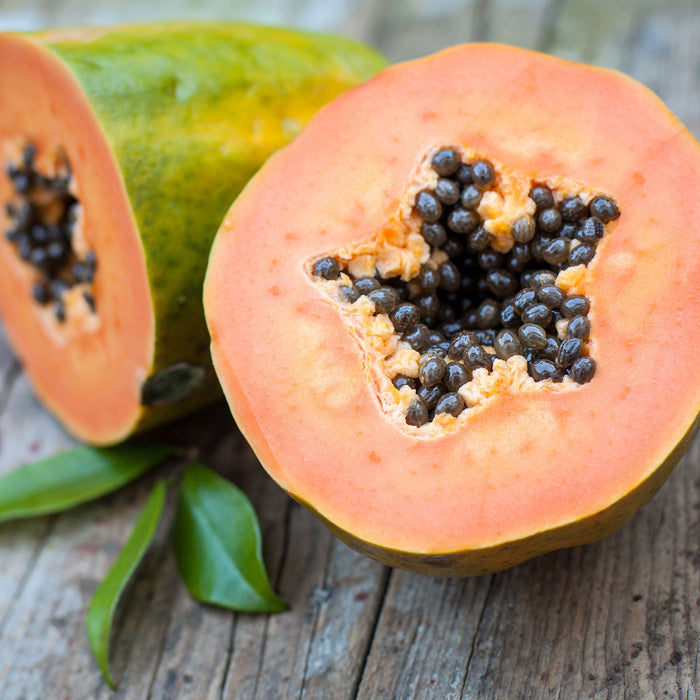Genüssliche Papaya aufgeschnitten, Glasbild Quadratisch