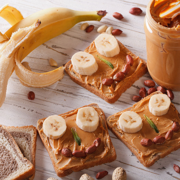 Erdnussbutter Bananen Sandwich, Glasbild Quadratisch