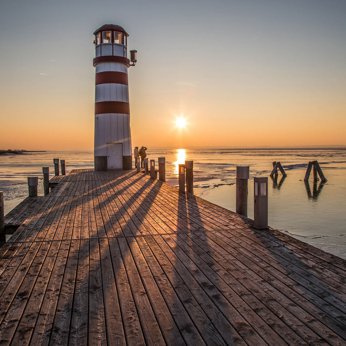 Leuchtturm im Sonnenuntergang, Glasbild Quadratisch