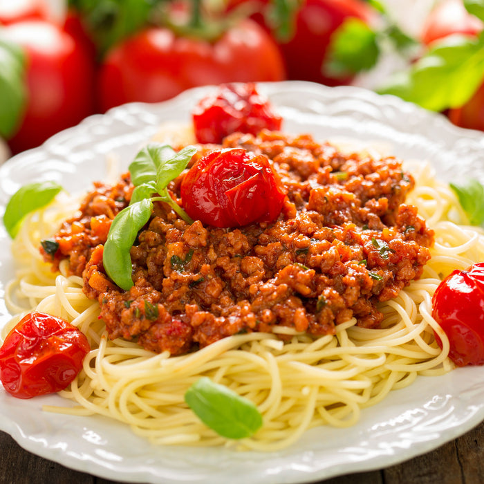 Spaghetti Bolognese auf dem Teller, Glasbild Quadratisch