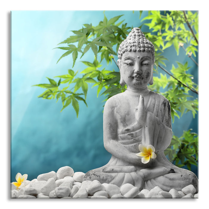 Buddha auf Steinen mit Monoi Blüte, Glasbild Quadratisch