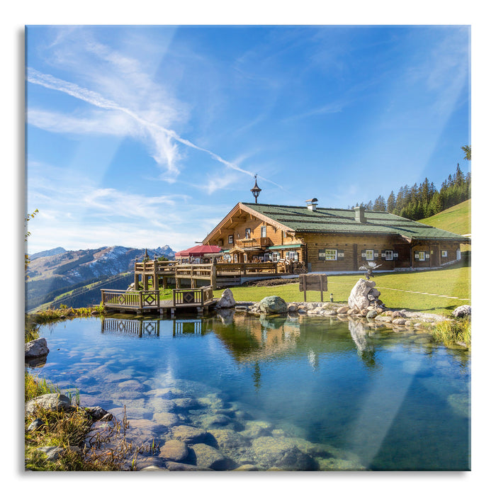 Schönes Haus in den Alpen, Glasbild Quadratisch