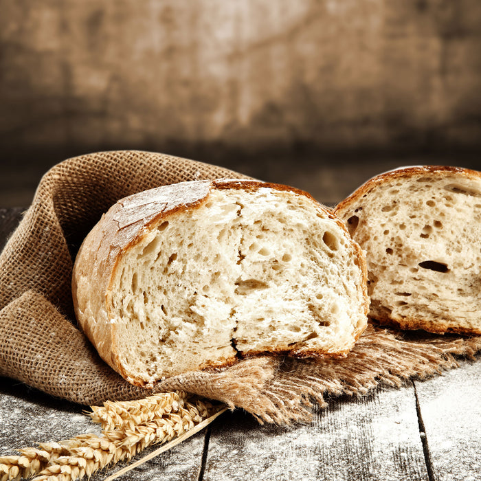 Krosses Bauernbrot, Glasbild Quadratisch