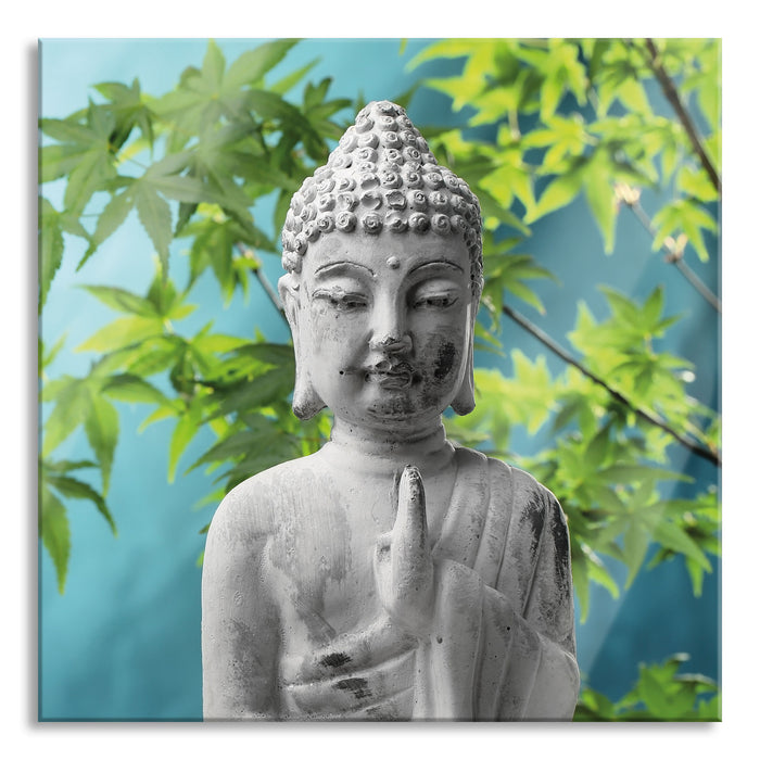 Buddha auf Steinen mit Monoi Blüte, Glasbild Quadratisch