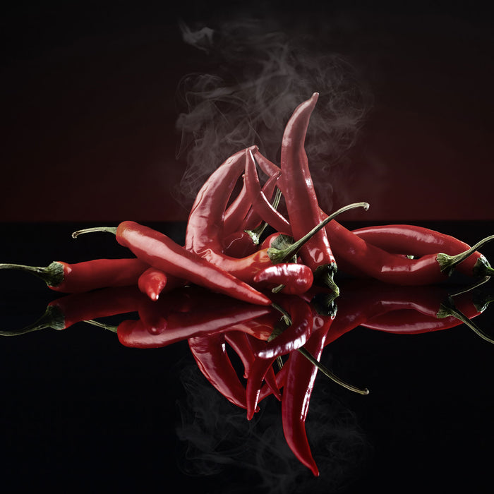 Feurige rote Chili-Schoten, Glasbild Quadratisch