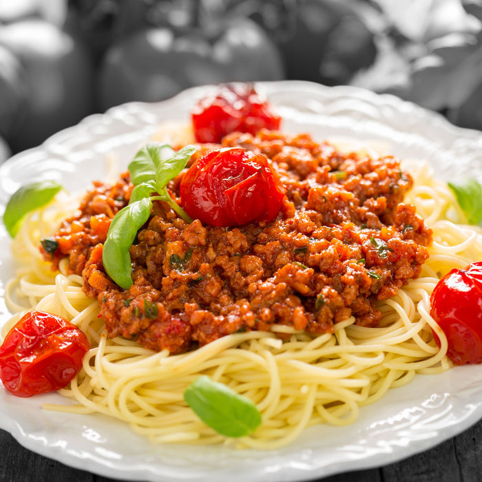 Spaghetti Bolognese auf dem Teller, Glasbild Quadratisch