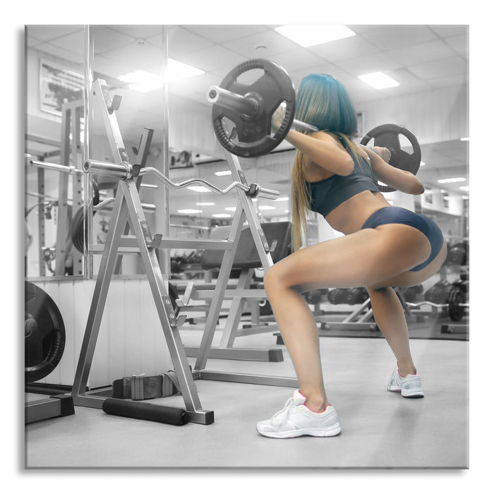 Pixxprint Sportliche Frau mit Hantelstange, Glasbild Quadratisch