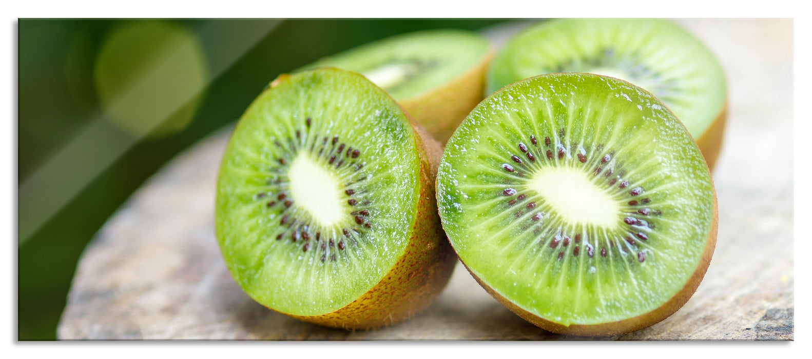 Pixxprint Leckere aufgeschnittene Kiwis, Glasbild Panorama