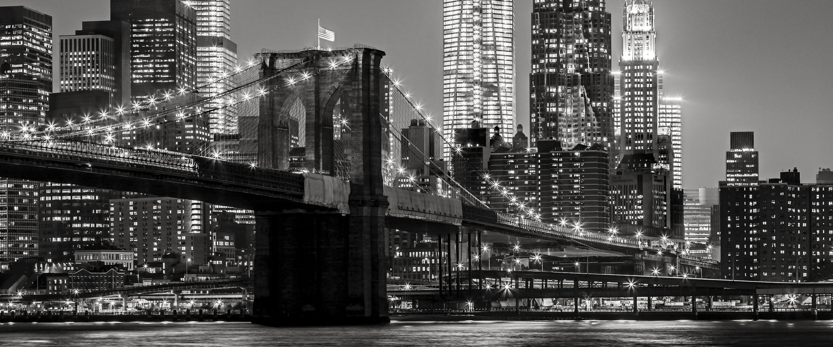 New York City Skyline bei Nacht, Glasbild Panorama