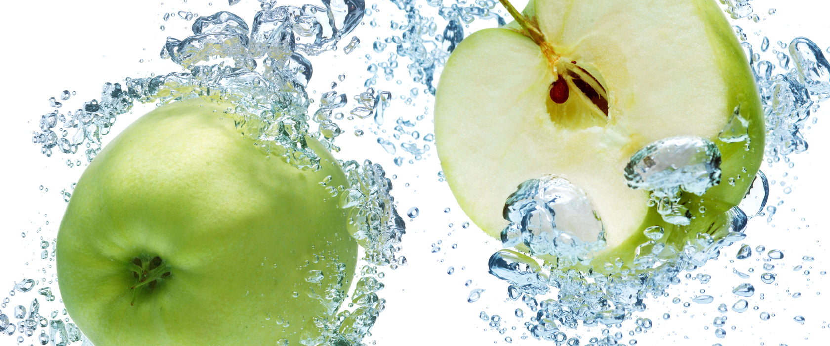 Frische Apfelscheiben im Wasser, Glasbild Panorama