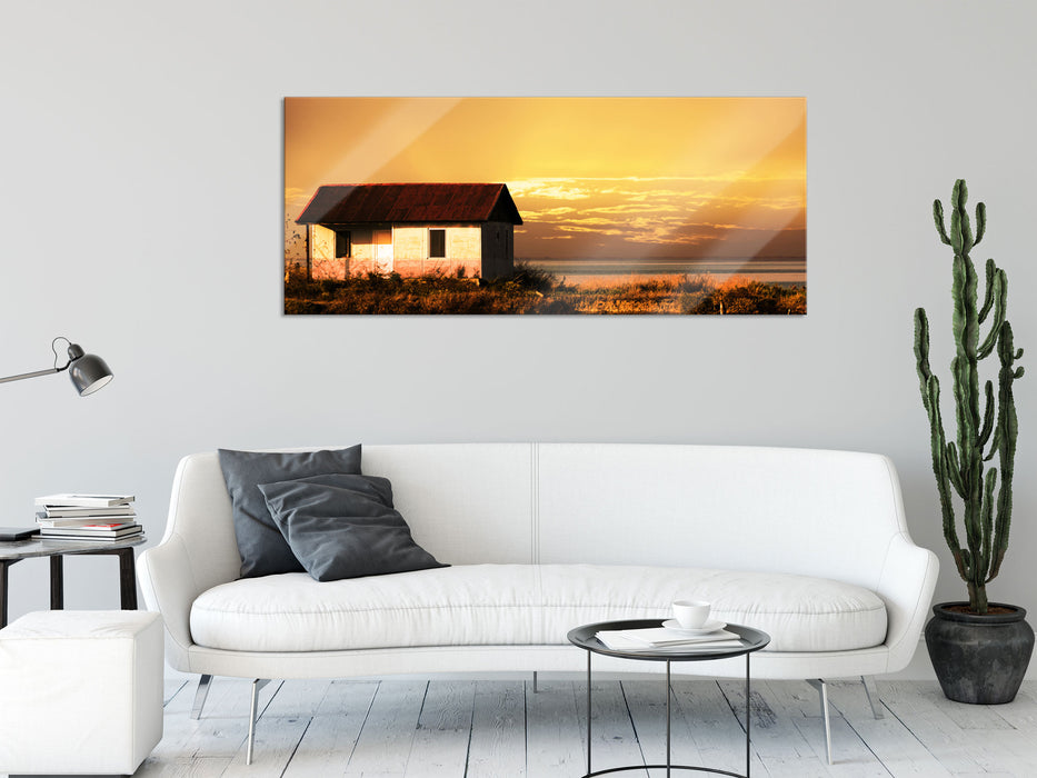 Haus am See bei Sonnenuntergang, Glasbild Panorama