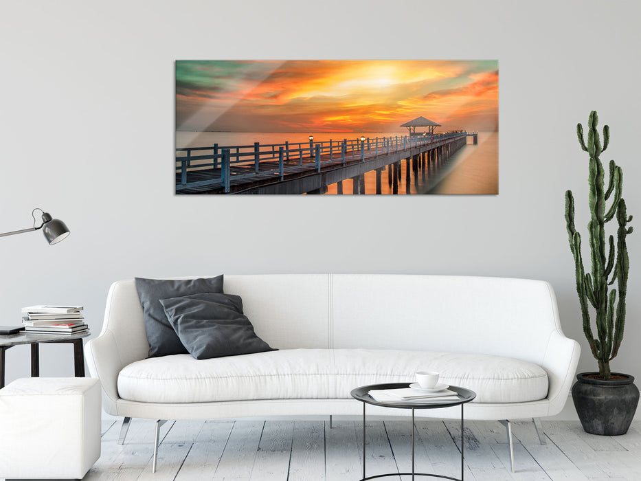 Steg ins Meer bei Sonnenuntergang, Glasbild Panorama