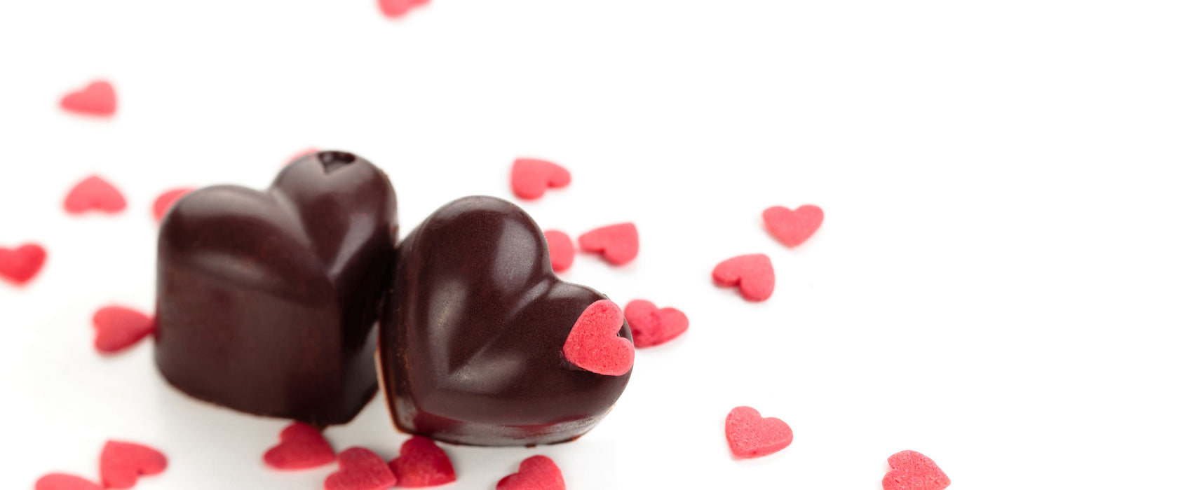 Schokoladenherzchen, Glasbild Panorama