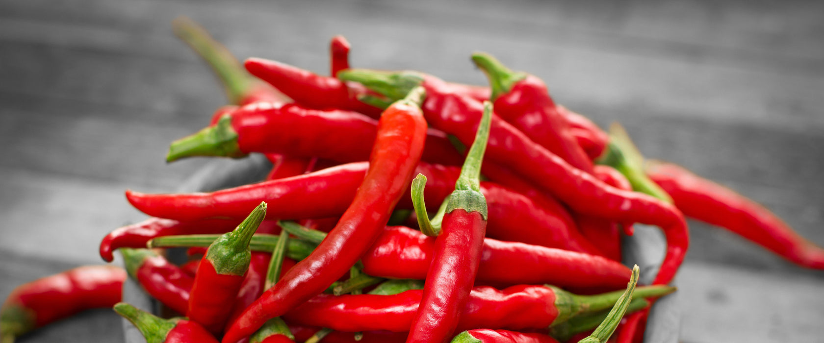 Scharfe Chilishoten, Glasbild Panorama