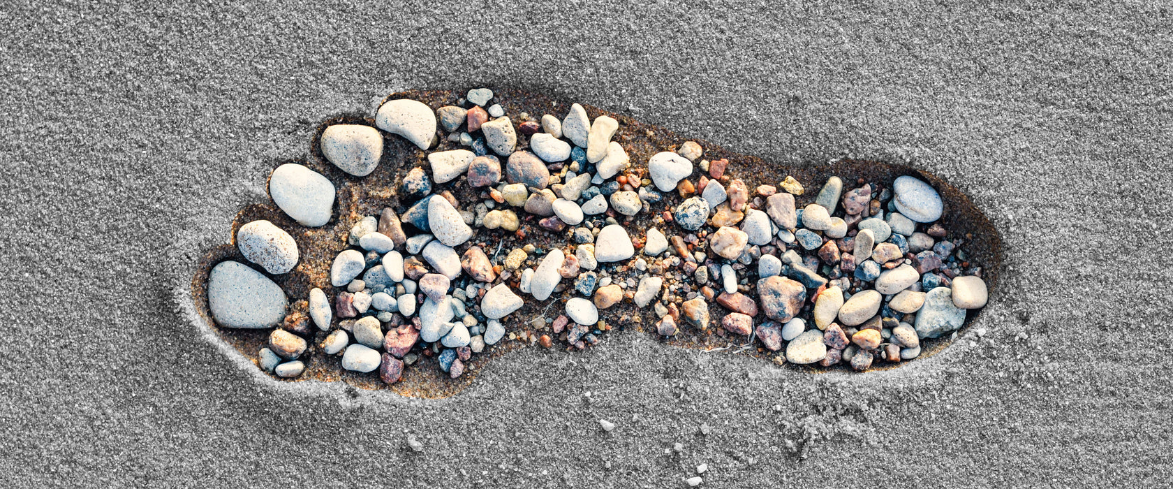 Fußabdruck im Sand, Glasbild Panorama