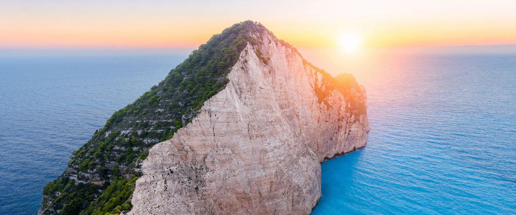 Nagio Strand im Sonnenuntergang, Glasbild Panorama