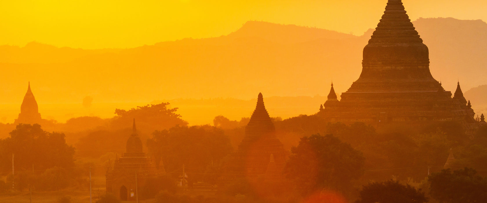 Buddha Tempel im Sonnenuntergang, Glasbild Panorama