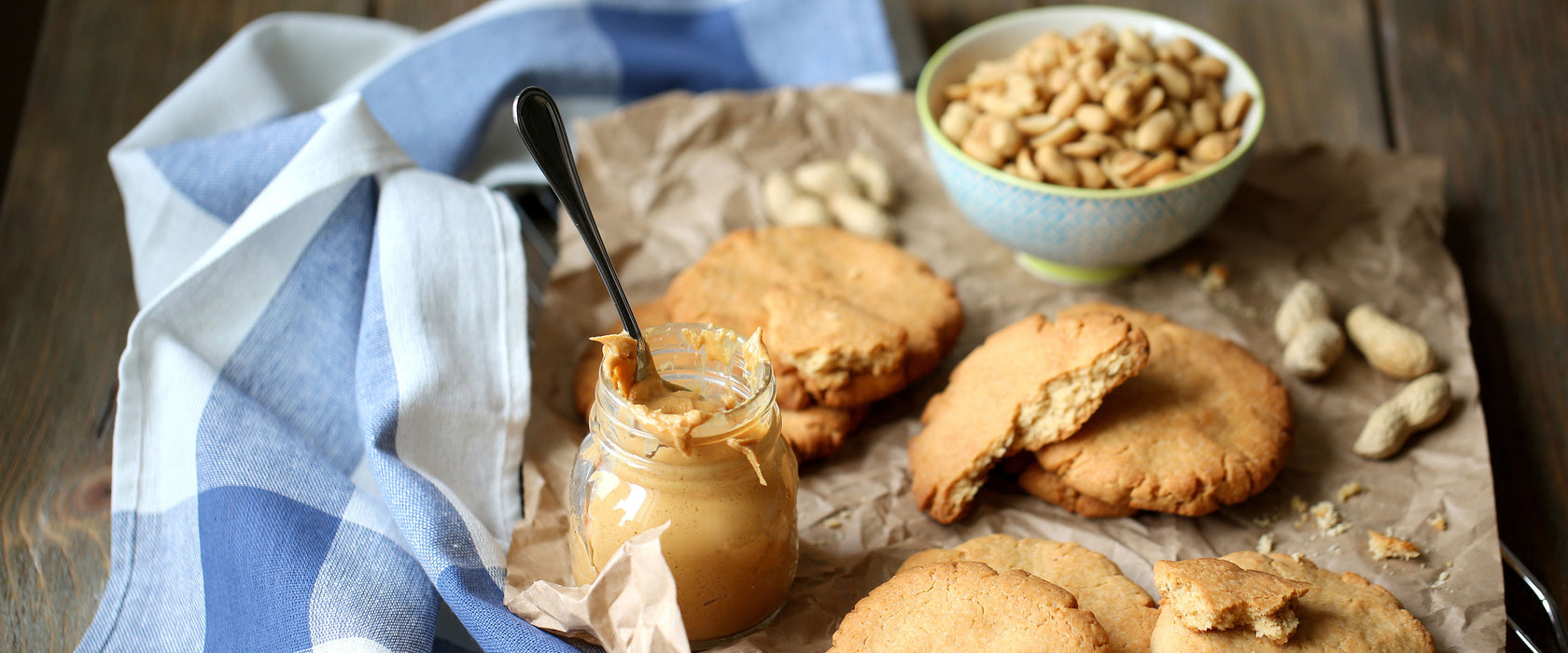 Plätzchen mit Erdnussbutter, Glasbild Panorama