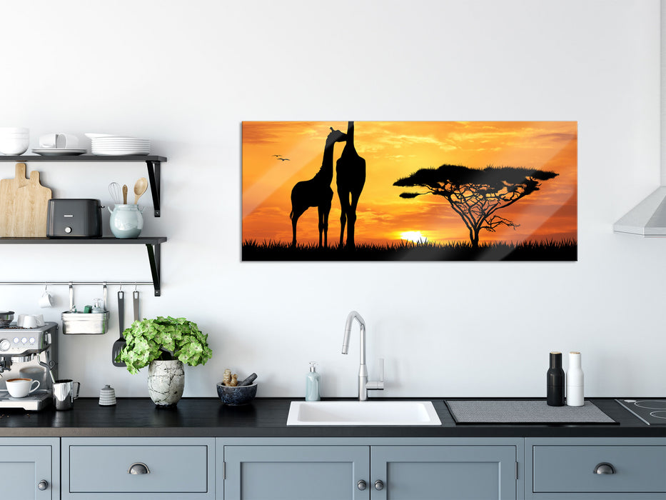 Giraffen im Sonnenuntergang, Glasbild Panorama