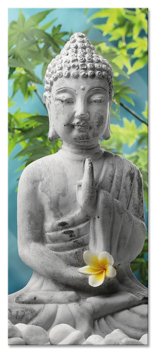 Buddha auf Steinen mit Monoi Blüte, Glasbild Panorama