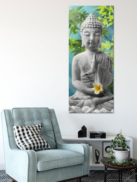 Buddha auf Steinen mit Monoi Blüte, Glasbild Panorama