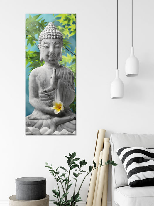 Buddha auf Steinen mit Monoi Blüte, Glasbild Panorama