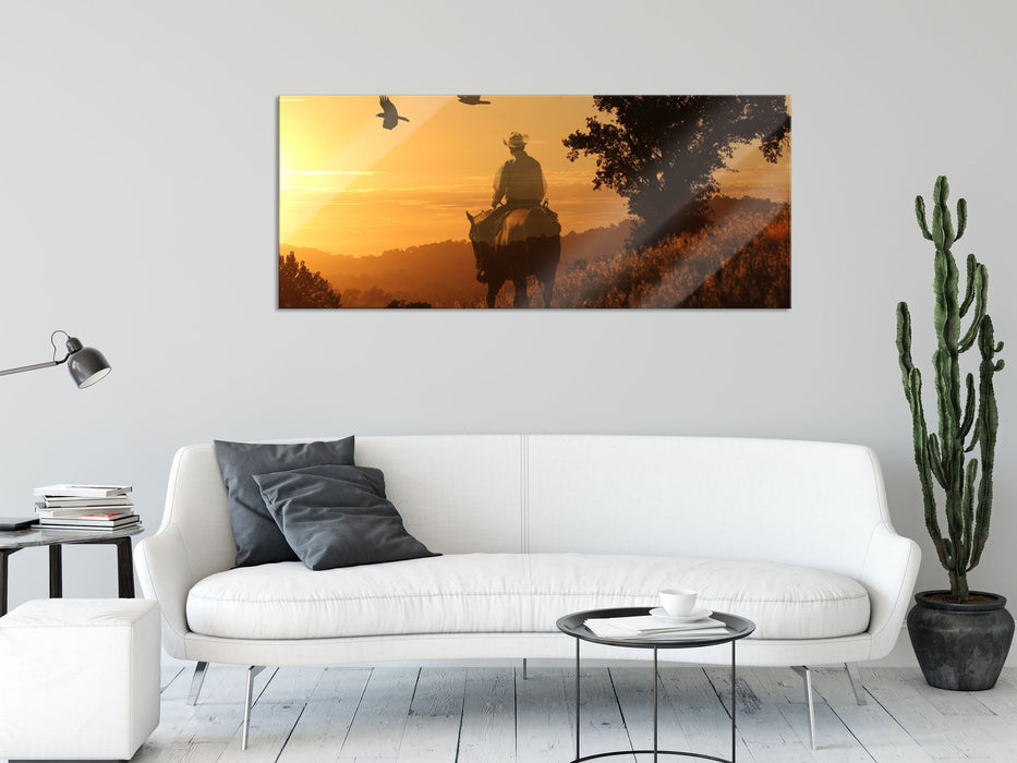 Ein Cowboy im Sonnenuntergang, Glasbild Panorama