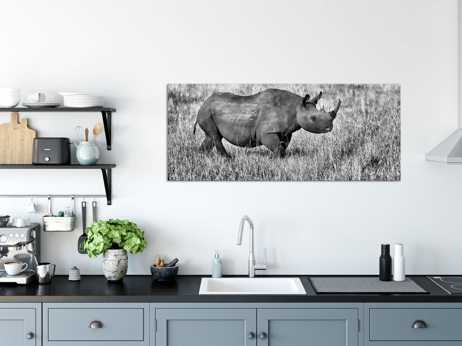 großes Nashorn mit Zebrahorde, Glasbild Panorama