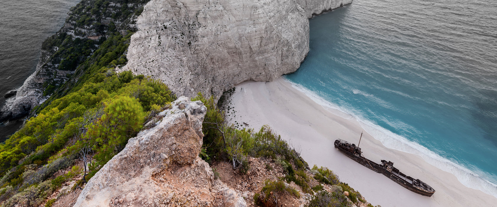 Nagio Strand im Sonnenuntergang, Glasbild Panorama