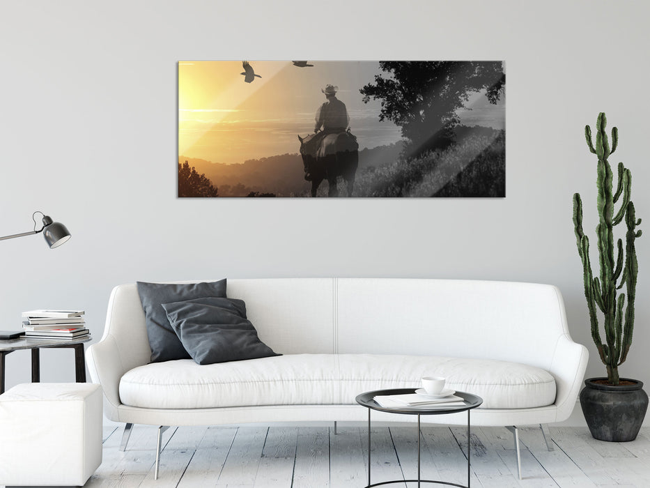 Ein Cowboy im Sonnenuntergang, Glasbild Panorama