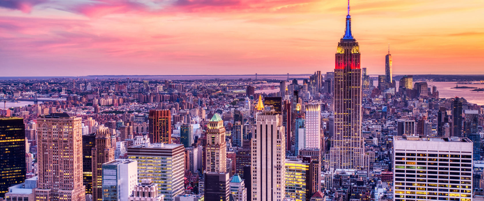 New York City bei Sonnenuntergang, Glasbild Panorama