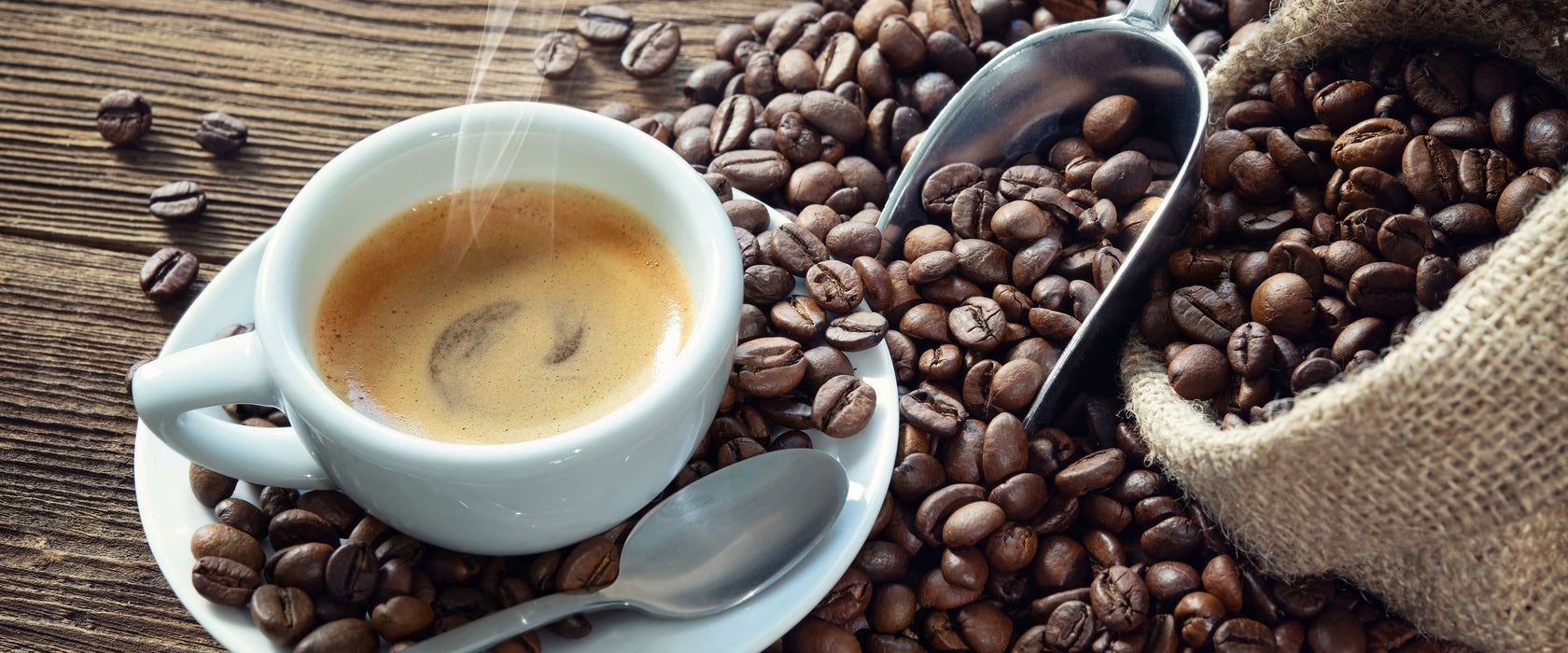 Espressotasse mit Kaffeebohnen, Glasbild Panorama