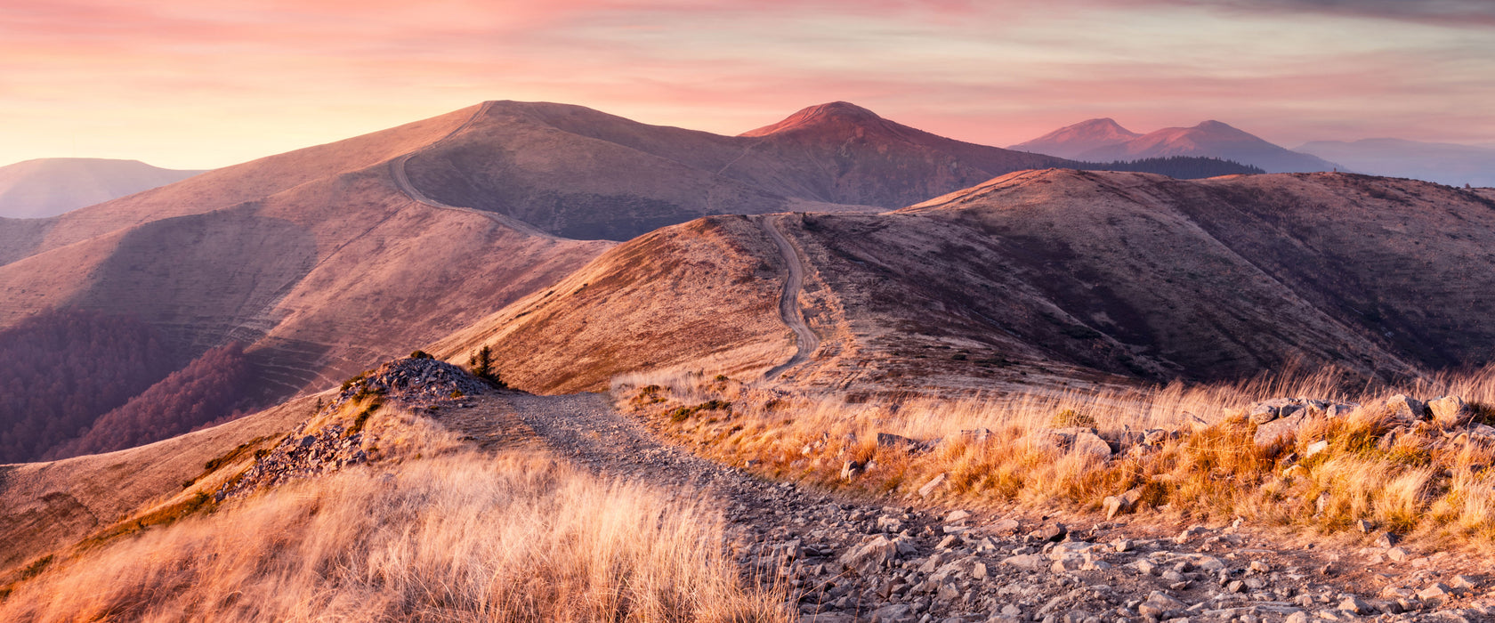 Steinlandschaft bei Sonnenuntergang, Glasbild Panorama